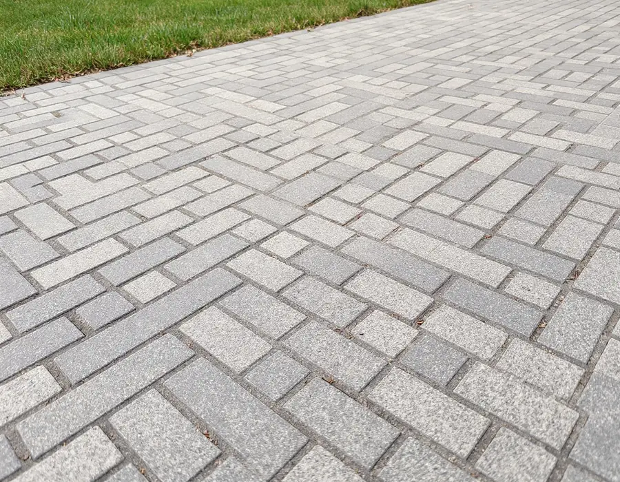 Illustration of a paver driveway surface, shown for comparison